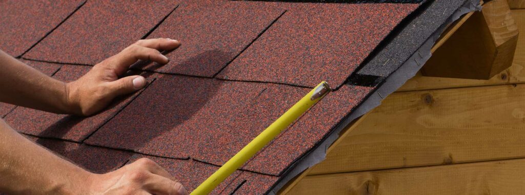 Commercial Roofing Contractor Measuring a Roof in Woodland Park, Pueblo, Colorado Springs, and Nearby Cities